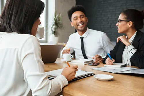 A CLEAR team meeting with a small business client